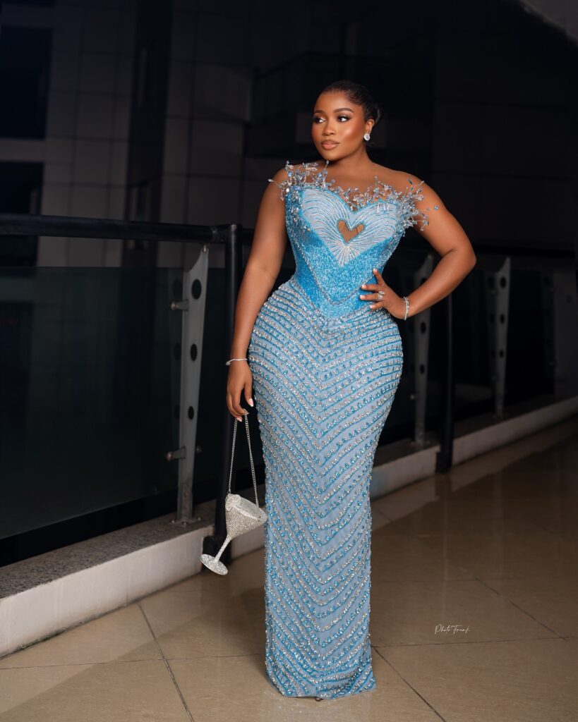 Elegant soft blue gown worn by Veekee James, designed by Bukola Crystals.
